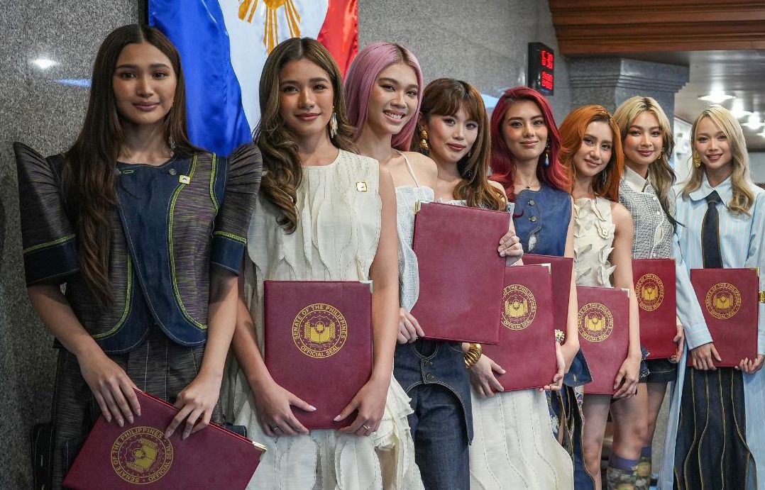 The eight members of BINI at the Philippine Senate in 2026, holding framed resolutions
